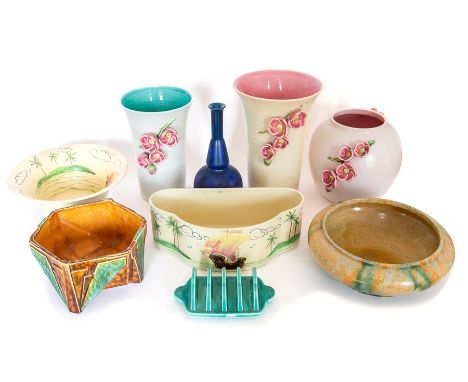 A group of Art Deco Bretby Art Pottery pieces to included: three vases with floral applied decoration, two planters, a blue-g