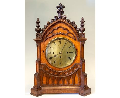 Kippax, Retford, a mid 19th Century musical oak bracket clock of Gothic Revival design, the arched case incorporating carved 