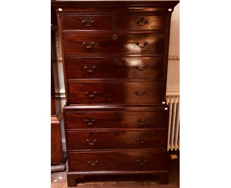 A George III mahogany chest on chest, circa 1770, plain cornice, two short over three long drawers with brass drop handles an