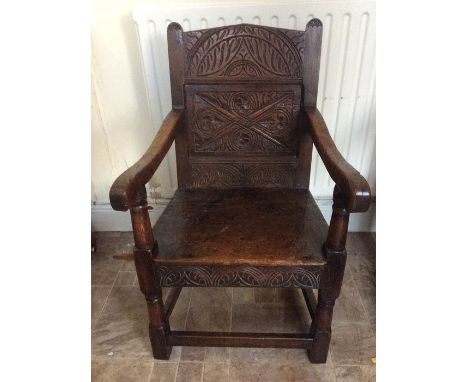 A Carolean style joined oak Wainscot armchair, 19th Century, incorporating earlier timbers, carved crest rail, carved panel t