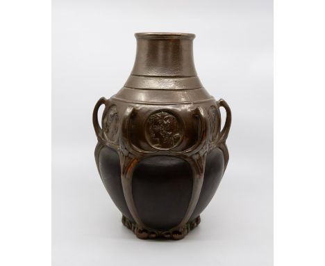 A Bretby art pottery bronzed Art Nouveau multi-handled baluster vase, the frieze with circular portrait medallions, No. 1771.