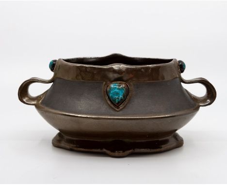 A Bretby art pottery bronzed and jewelled twin-handled planter, No. 1627. 24 cm wide.Condition: In good overall condition. 