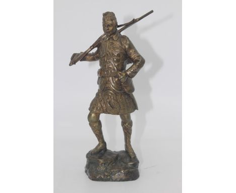 Georges Omerth (act.1895-1925), a bronze study of a WWI Scottish Soldier holding a rifle over his shoulder, standing on a bas