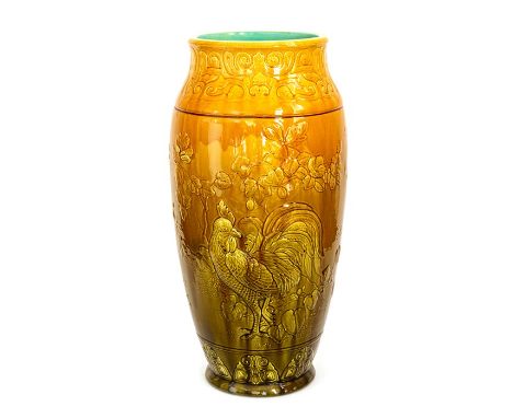 A Bretby Art Pottery large vase with art nouveau motifs to the rim, a cockerel to one side and a bird in a tree to the other,