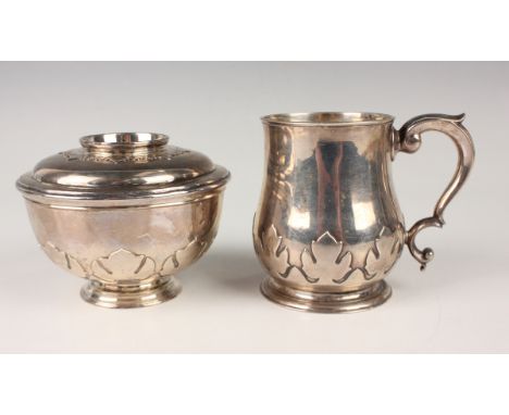 A George V silver tankard with scroll handle, the baluster body decorated with cut-card foliate band, London 1920 by Goldsmit