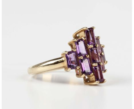 A 9ct gold and amethyst cluster ring, claw set with nine rectangular step cut amethysts, Birmingham 2007, weight 3.1g, ring s