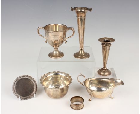 A small group of silver, including a two-handled trophy cup, Birmingham 1925, height 10.5cm, a sauceboat, Birmingham 1937, an