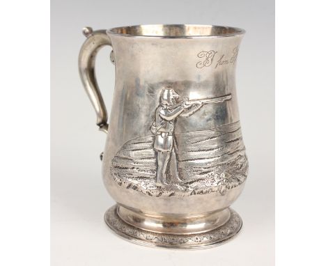 A George II silver baluster tankard with scroll handle, later repoussé decorated with an American soldier aiming a rifle at a