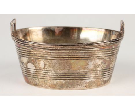 A George III silver novelty salt in the form of a coopered oval pail, weight 70.6g, length 8.5cm (marks rubbed).Buyer’s Premi