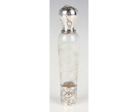 An early 20th century French silver mounted clear glass lady's travelling flask, the silver screw cover and detachable cup de