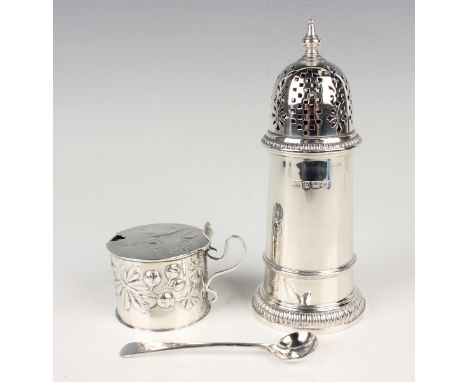 A late Victorian silver cylindrical mustard, the hinged lid embossed with scrolling tendrils above fruiting chestnut stems, f