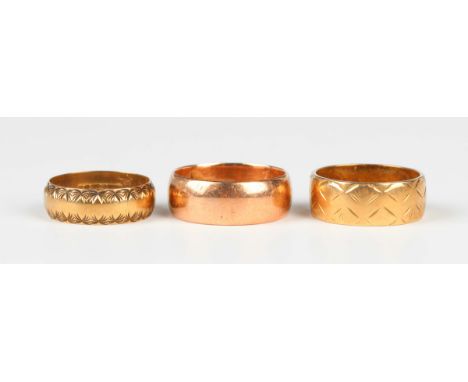 A 9ct gold wedding ring, Birmingham 1914, ring size approx Q, and two 9ct gold decorated wedding rings, total weight 13.1g.Bu