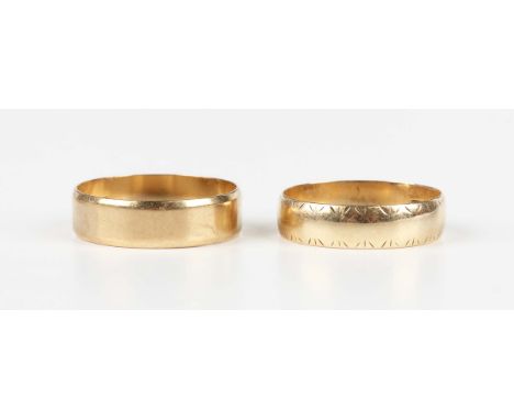 A 9ct gold wide band wedding ring, London 1987, ring size approx U, and a 9ct gold wide band wedding ring with engraved decor