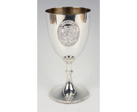 An Edwardian silver trophy goblet, the 'U' shaped body applied with the 'London Athletic Club' crest, on a beaded knop stem a