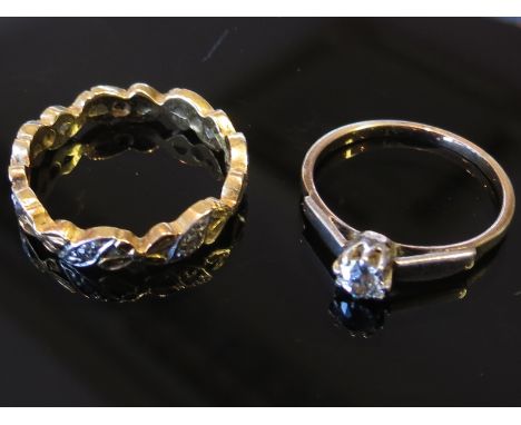 Two gold rings, one set with single diamond the other a gold and platinum eternity ring with diamond chips, stamped 18ct, siz