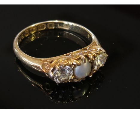 An 18ct gold diamond and pearl ring the central grey pearl flanked by .25ct approx diamonds, size O/P, 4g