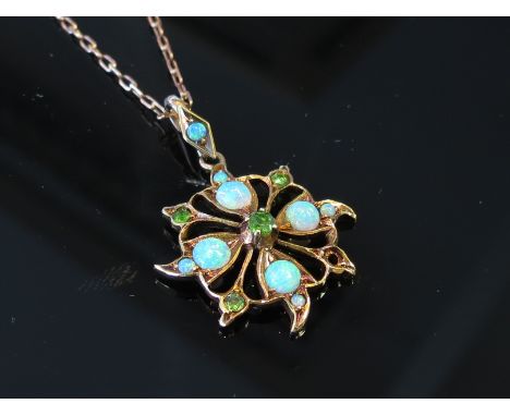 A gold opal and green stone set pendant (one green stone missing) hung on chain stamped 9ct, 3.7g