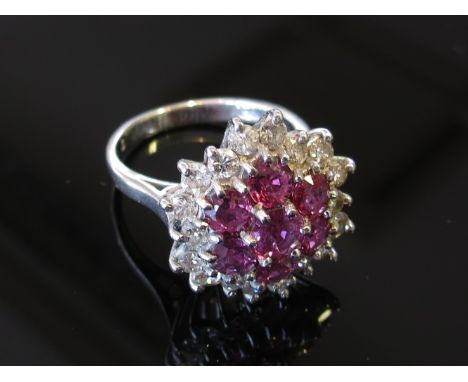 An 18ct white gold diamond and ruby cocktail ring, size M, 6.9g