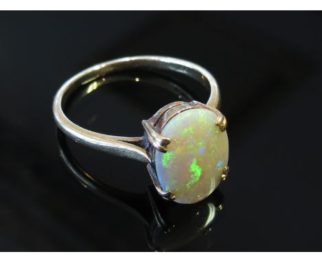 A gold opal ring stamped 18ct, size S, 3.5g