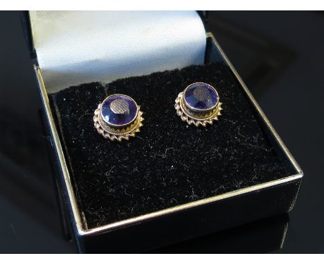A pair of amethyst stud earrings, a gold amethyst and pearl floral brooch and another (3)