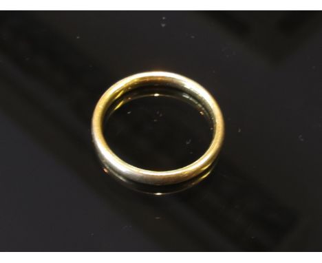 A 22ct gold band, size K, 2.9g 