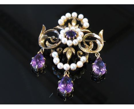 A 9ct gold pearl and amethyst brooch hung with three amethyst droplets