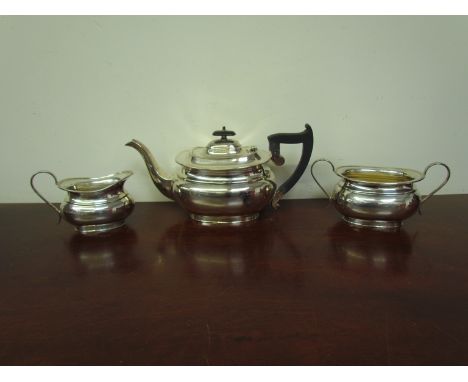 A Viner's Ltd (Emile Viner) silver three piece tea set consisting of teapot, milk jug and twin handle sucrier, Sheffield 1921