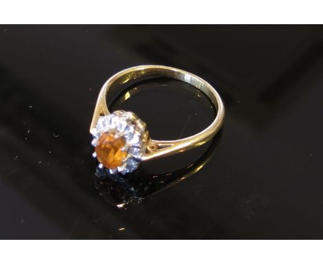 A gold diamond and citrine ring stamped 18ct, size O, 3.2g