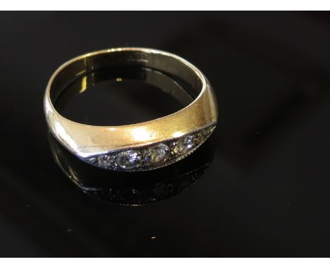 An 18ct gold ring set with five graduated diamonds. Size K, 3.2g