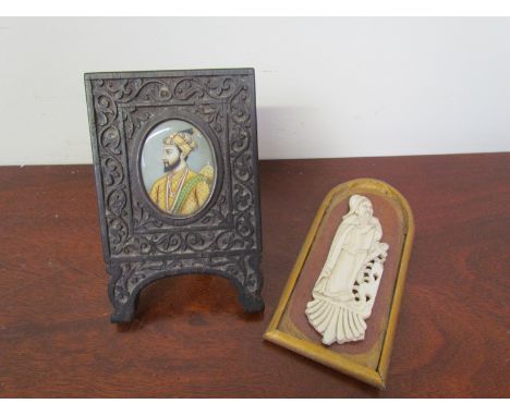 A carved ivory icon on wooden board and an Eastern frame set with miniature portrait.(2)