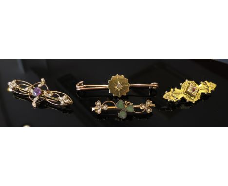 Four gold bar brooches including clover and seed pearl, amethyst and seed pearl and diamond set. 11g