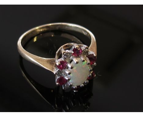 A 9ct gold opal, ruby and diamond ring, size Q, 2.6g