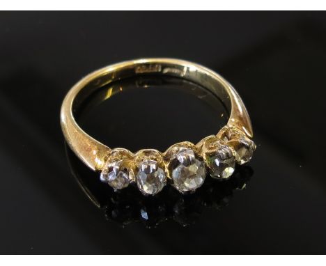 A gold five stone diamond ring with old cut diamonds stamped 18ct, size O/P, 3.4g