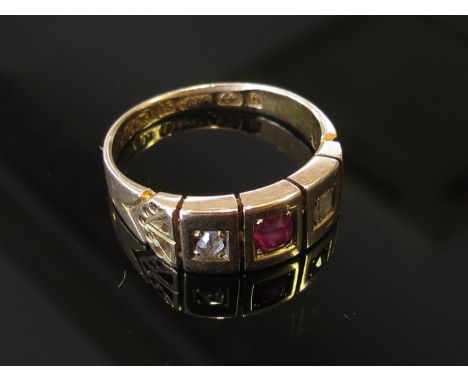 A 15ct gold ring centrally set with oval ruby flanked by old mine cut diamonds. Size M, 4.3g