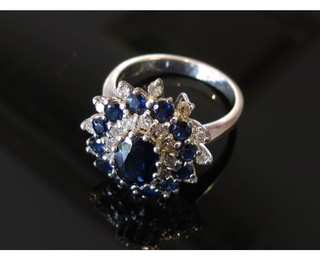 An 18ct white gold sapphire and diamond cocktail ring, size P, 6.8g