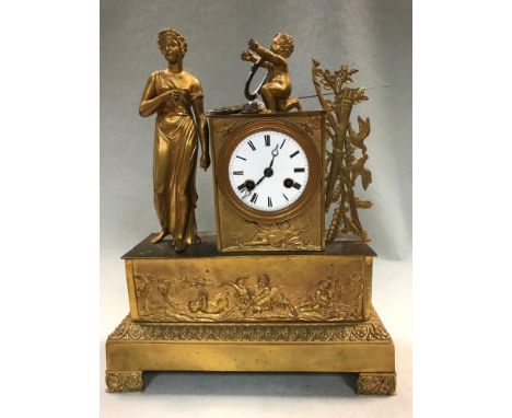 A French mid-19th century gilt metal mantel clock, the case with standing classical female figure beside a rectangular plinth