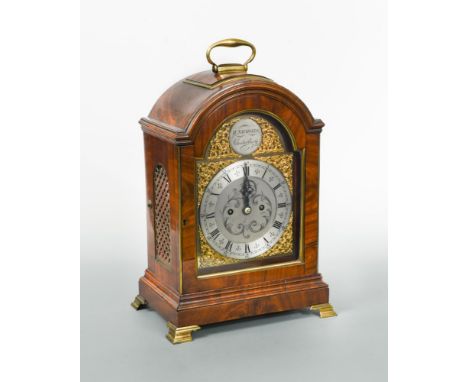A mahogany bracket clock circa 1800, the single pad top with handle above 7inch break-arch brass dial signed 'H. Nicholls, Ca