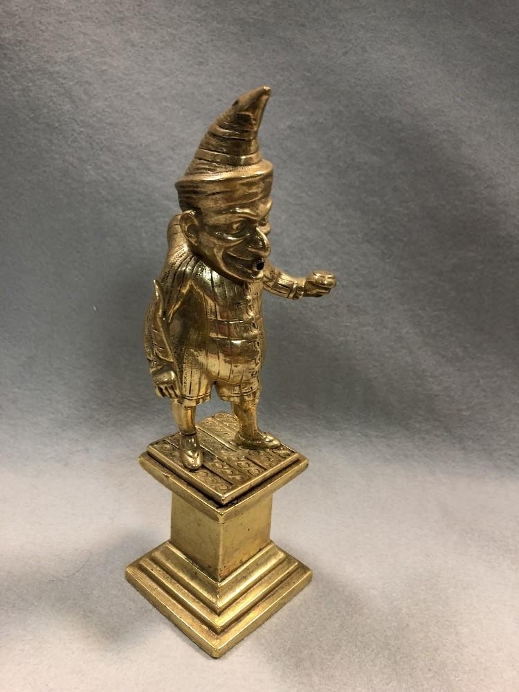 A Victorian gilt brass cigar lighter modelled as Mr Punch, modelled