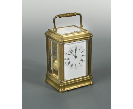 A French brass repeating carriage clock by Henri Jacot, the gorge case with rectangular enamel dial, silvered platform lever 