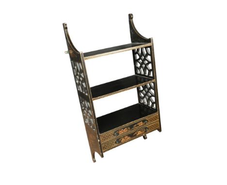 An Edwardian black and gilt lacquer hanging wall shelf, with pierced fret carved sides and two narrow drawers 84 x 41 x 21cm 