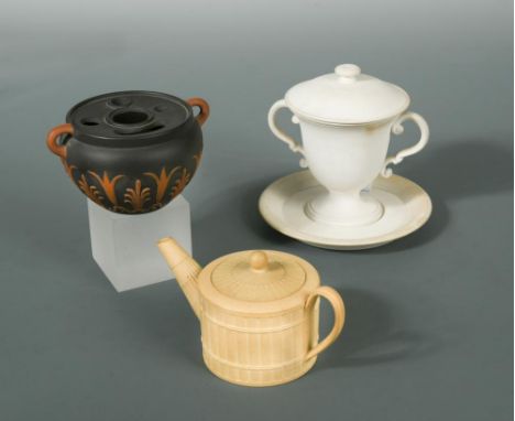 An 18th century miniature Wedgwood caneware teapot and cover, impressed 'WEDGWOOD', 12cm wide; a Wedgwood black basalt two- h