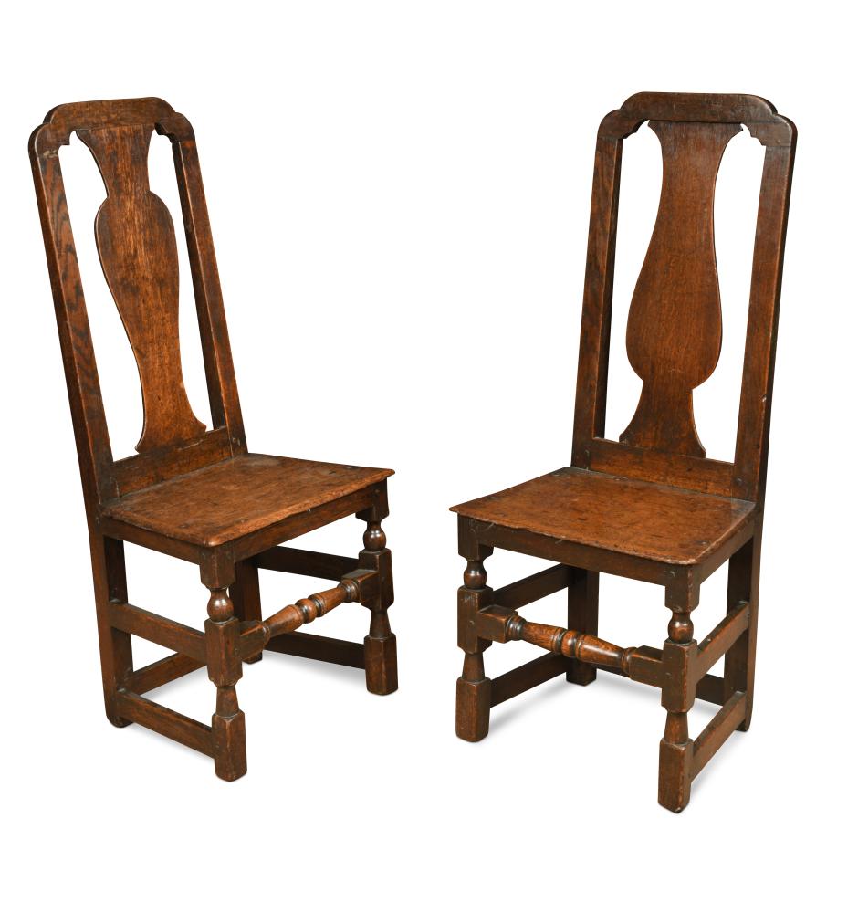 A pair of late 17th century high back oak joint chairs, with vase ...