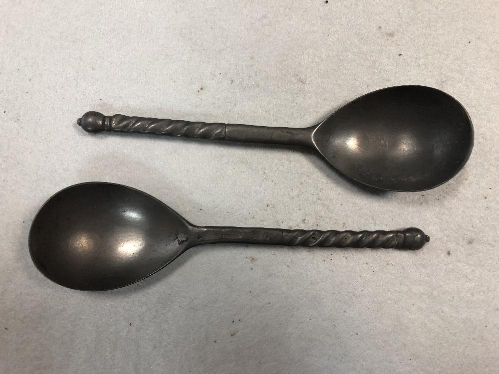 A set of three pewter shaped serving spoons, in Cheffins Fine Art