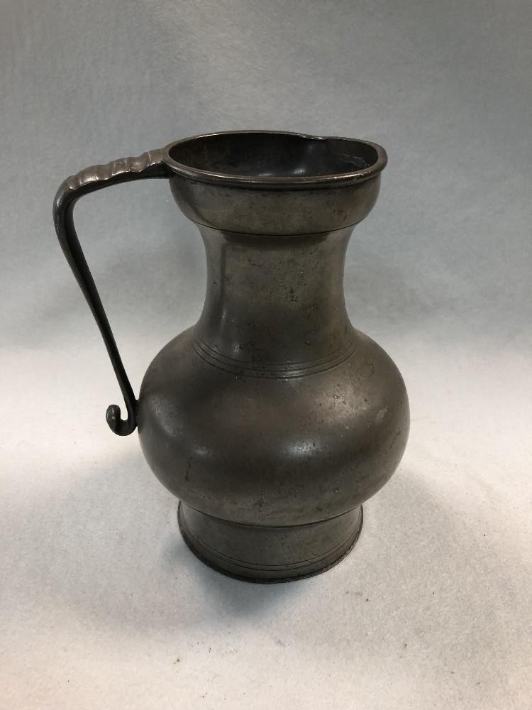 A late 17th or early 18th century STYLE pewter jug in - Cheffins Fine Art