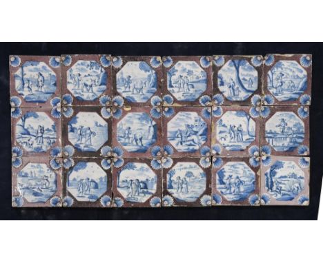 A set of twenty-five 18th century Delft tiles, the manganese 'sponged' bodies reserved with canted panels, decorated in blue 