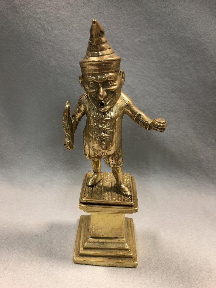 A Victorian gilt brass cigar lighter modelled as Mr Punch, modelled