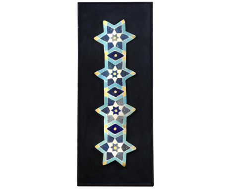 An Islamic Persian mosaic tile panel, the four six pointed star tiles united by three lozenge shaped tiles, in yellow, blue a