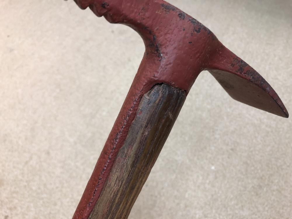 An early 20th century ice axe, with adze and serrated pick to a wooden