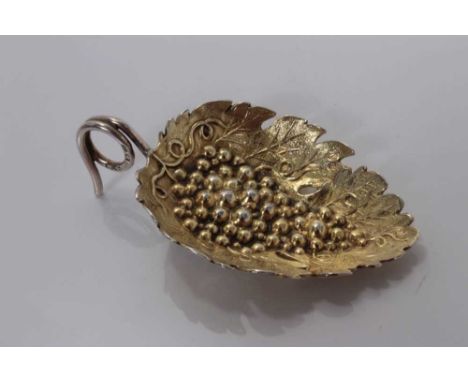 George III silver gilt leaf and grape embossed caddy spoon with loop handle, Birmingham 1808, maker rubbed 6.5cm