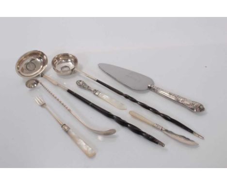 Two Georgian silver toddy ladles, the bases set with coins, together with a Victorian silver pickle fork and other silver cut